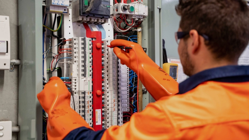 Licensed electrical and HVAC technicians performing mechanical system maintenance and repairs
